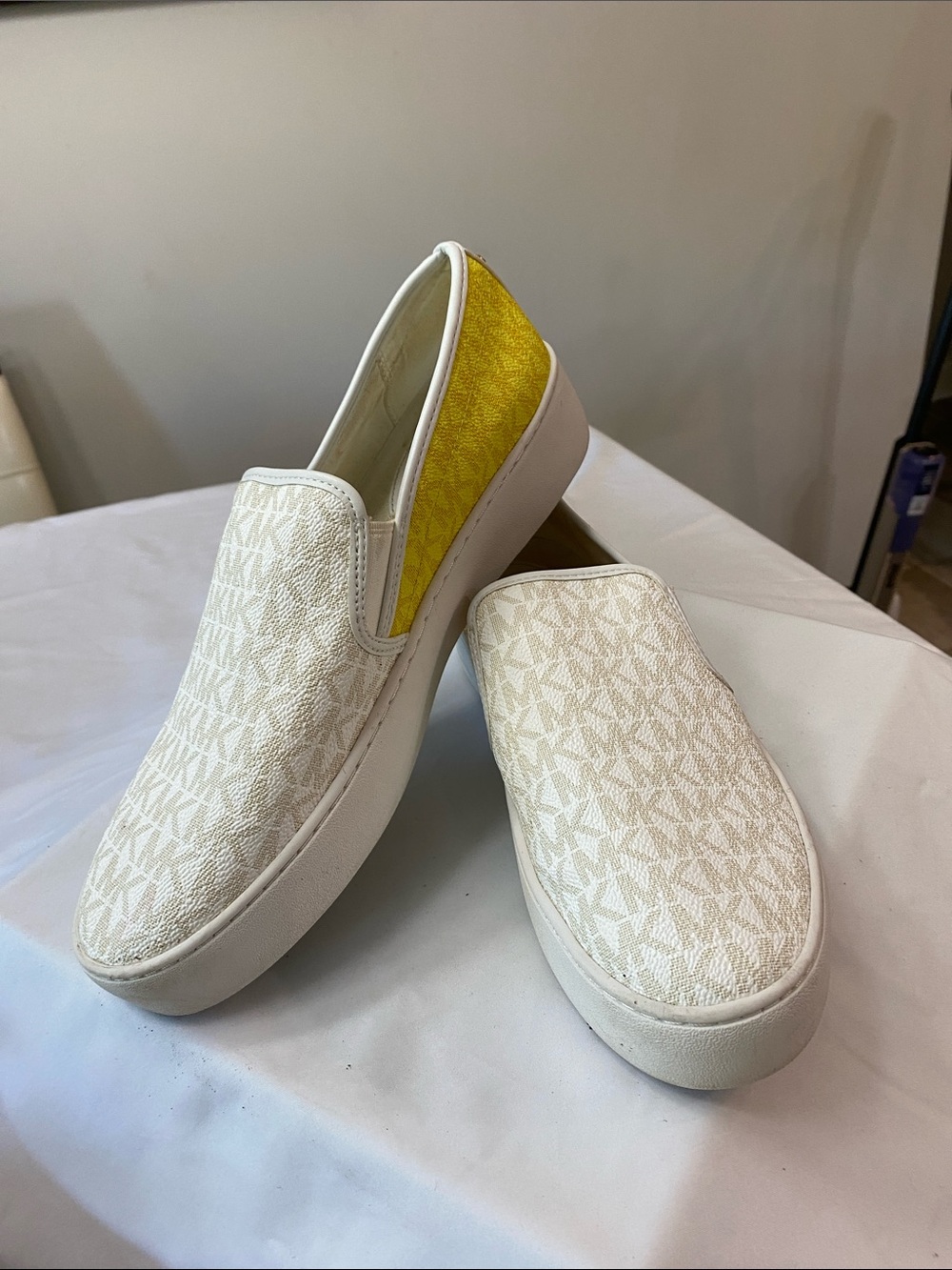 Michael Kors White Canvas Slip-On Sneakers with Yellow Heel Accent